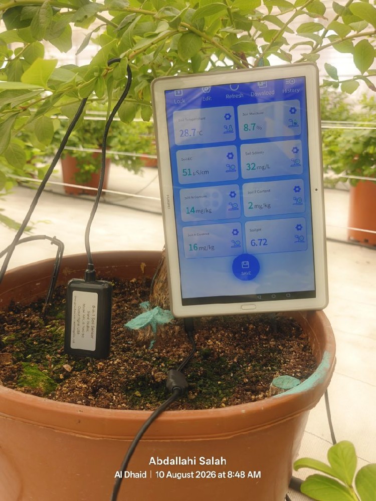 NiuBoL NBL-S-TMC-8C portable soil tester connected to a tablet during a soil check in the UAE