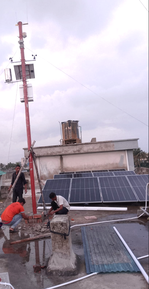 NiuBoL photovoltaic weather station installed beside rooftop solar panels in Bangladesh